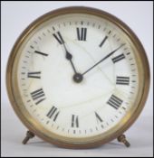 A vintage late 19th century brass circular barrel clock,