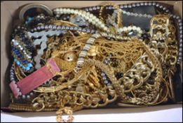 A large collection of costume jewellery to include rhinestone set bracelets and necklaces, rings,