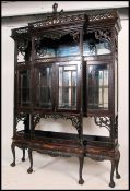 An impressive large Edwardian mahogany Chippendale style display cabinet on stand in the Chinese