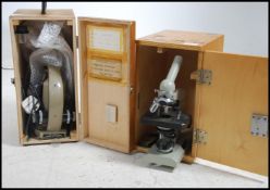 2 vintage mid century scientific wooden cased microscopes