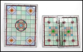 3 Victorian stained glass leaded panels having coloured roundels and central motif.