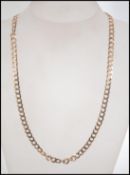A hallmarked 9ct gold diamond cut flat curb link chain necklace. Hallmarked for London.