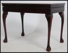 A Georgian style mahogany and tooled leather canteen of cutlery table.
