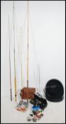 A collection of vintage and contemporary fishing rods and tackle to include various reels etc