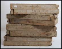 A set of 8 vintage industrial mid century apple crates - stacking. Wooden slatted construction.