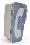 A retro 20th century cased wall mounted engineers telephone having a hinged door to the front.