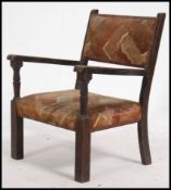 A 1930's childs chair of beech wood construction having shaped elbow rests on squared legs.