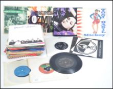 A collection of 45rpm records dating from the 1960's.
