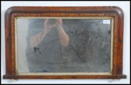 A Victorian walnut tunbridge inlaid wall mirror - overmantel mirror having ceramic bun feet.