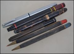 A collection of vintage 20th century pens and propelling pencils with coloured lead.