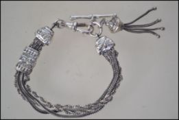 A silver gentlemans watch chain having C-clasp with snake lined chain and applications complete