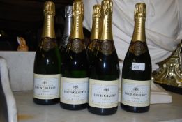 Six unopened bottles of Brut Champagne to include five bottles of louis Chaurey and a bottle of