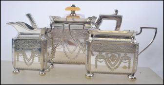 A 20th century Edwardian bachelors three piece tea service consisting of teapot sugar bowl and