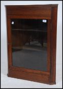 A late 19th / early 20th century Victorian glazed hanging corner cabinet.