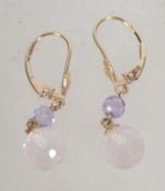 A pair of 9ct gold earrings with amethyst drops. Weight 2.
