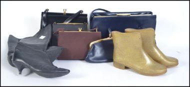 A pair of original vintage 1960's ladies black leather boots on a kitten heel with a zip running