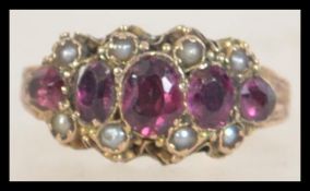 A 9ct gold amethyst and seed pearl ring.
