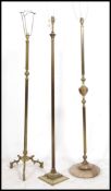 3 20th century neo classical brass standard lamps, each with reeded column centres,