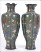 A pair of 19th century Japanese bulbous Cloisonne enamel on copper vases having a scalloped rim and
