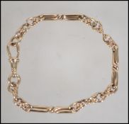 A hallmarked 9ct gold twist chain link bracelet with fob clasp. Weight 16.6g.