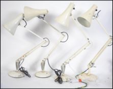 A group of three 20th century vintage / retro 1970's Herbert Terry Anglepoise lamps with a white