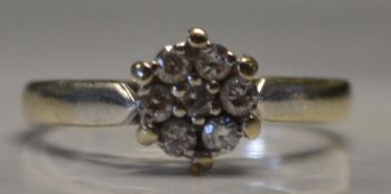 A hallmarked 18ct white gold diamond clu