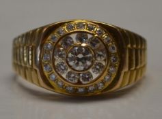 A 21ct gold and diamond ring with centra