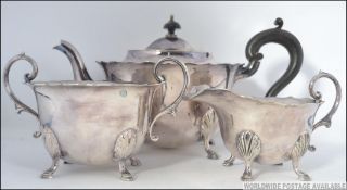 A silver plate 3 piece tea service compr