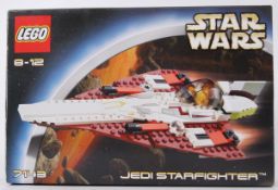 STAR WARS: An original Lego Star Wars Jedi Starfighter 7143 set.