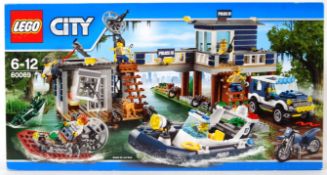 LEGO CITY: A Lego City set 60069 ' Swamp Police Station ' set. Factory sealed, unused.