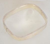A 925 silver contemporary bangle. Marked 925. Weight 19.4g. Diameter widest point 7cms.