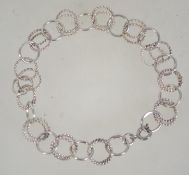 A Maltese silver twin hooped linked bracelet. Marked 917 with Maltese Cross. Measures 8 inches.