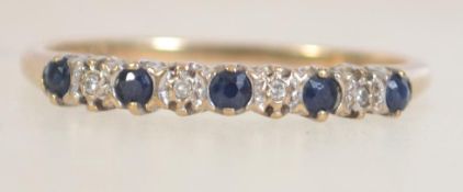 A hallmarked 9ct gold sapphire and diamond half eternity ring. Import marks for Birmingham. Size P.
