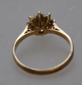 A 9ct gold diamond cluster daisy ring, the diamonds approx 40- points. Size L. Tests 9ct gold.
