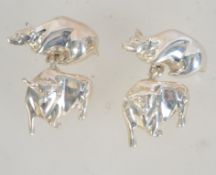 A pair of hallmarked 925 silver chain link cufflinks in the form of a Bull and a Bear.
