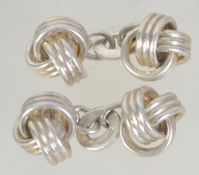 A pair of hallmarked Links of london 925 silver chain link cufflinks in the form of knots.