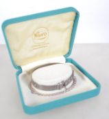 A silver machine turned christening bangle together with a silver link bracelet. 15.