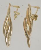 A pair of 9ct gold drop earrings with post backs. Test 9ct gold. Measure 4cms.