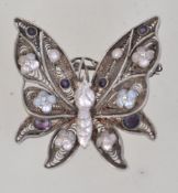 A vintage 925 silver filigree and enamel butterfly brooch with roller clip clasp. Marked 925 S.