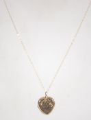 A 9ct gold pendant necklace with heart shaped 9ct back and front locket. Chain marked 9ct.