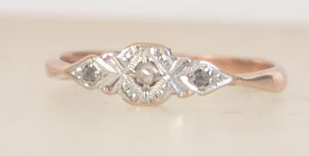 An Art Deco 9ct gold and platinum ring with central rose cut diamond. Size M.