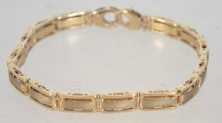 A hallmarked 9ct gold ladies designer bracelet with twin claw clasp. Hallmarked Sheffield.