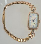 A hallmarked Art Deco 9ct gold cocktail watch having a MOP enamel face with a Swiss 10 Jewel