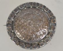 An early 20th century silver brooch with star and Middle Eastern engraving with c clasp. .