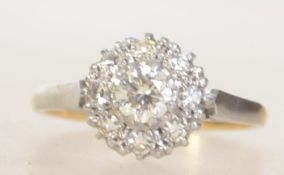 A ladies 18ct gold and platinum diamond cluster ring.