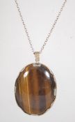 A hallmarked 925 silver and tigers eye pendant necklace.