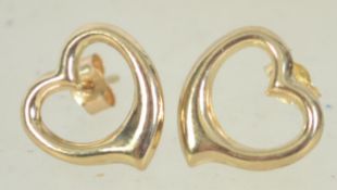 A pair of 9ct gold earrings in the shape of hearts with post backs. Test 9ct gold.