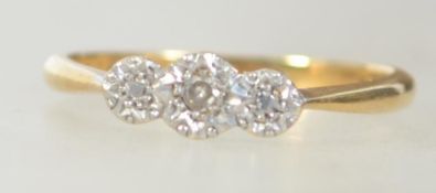 An 18ct gold and platinum diamond ring set with a central diamond .