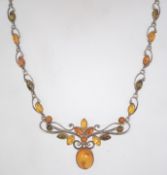 A 925 silver Art Nouveau style amber cabochon festoon necklace. Marked 925. Measures 16 inches.