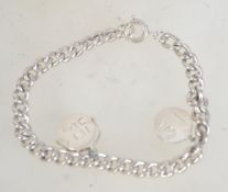 A hallmarked Edwardian silver bracelet with later 